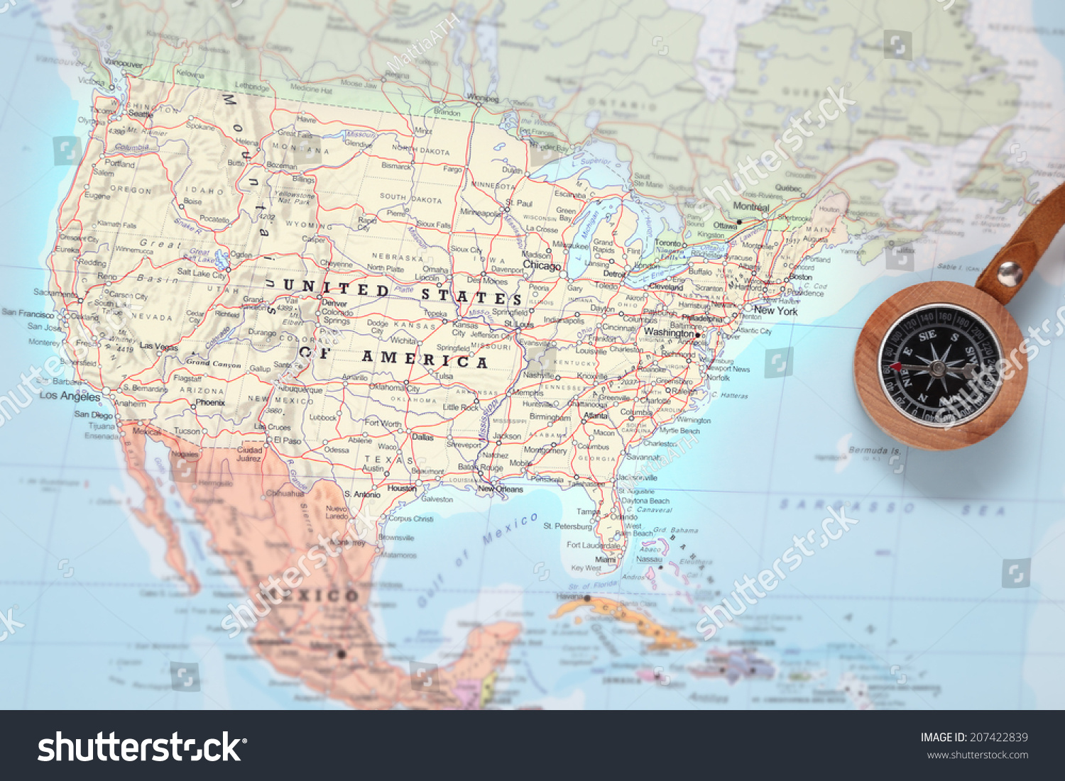 Compass on a map pointing at United States and planning a travel destination #207422839