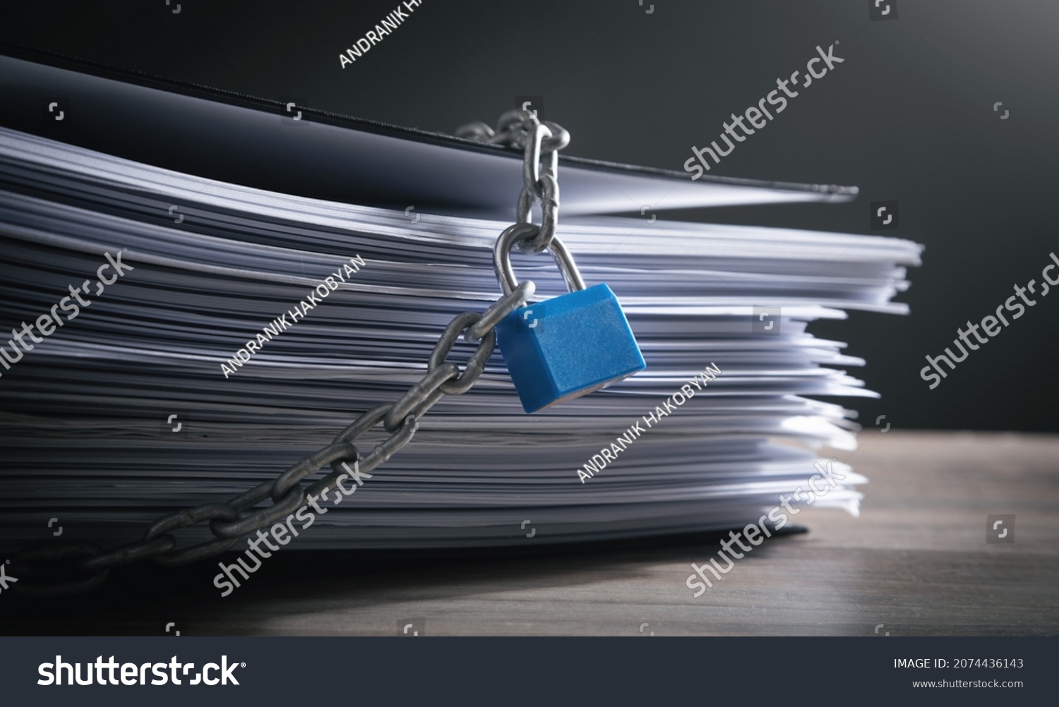 Documents locked with padlock and chains. #2074436143