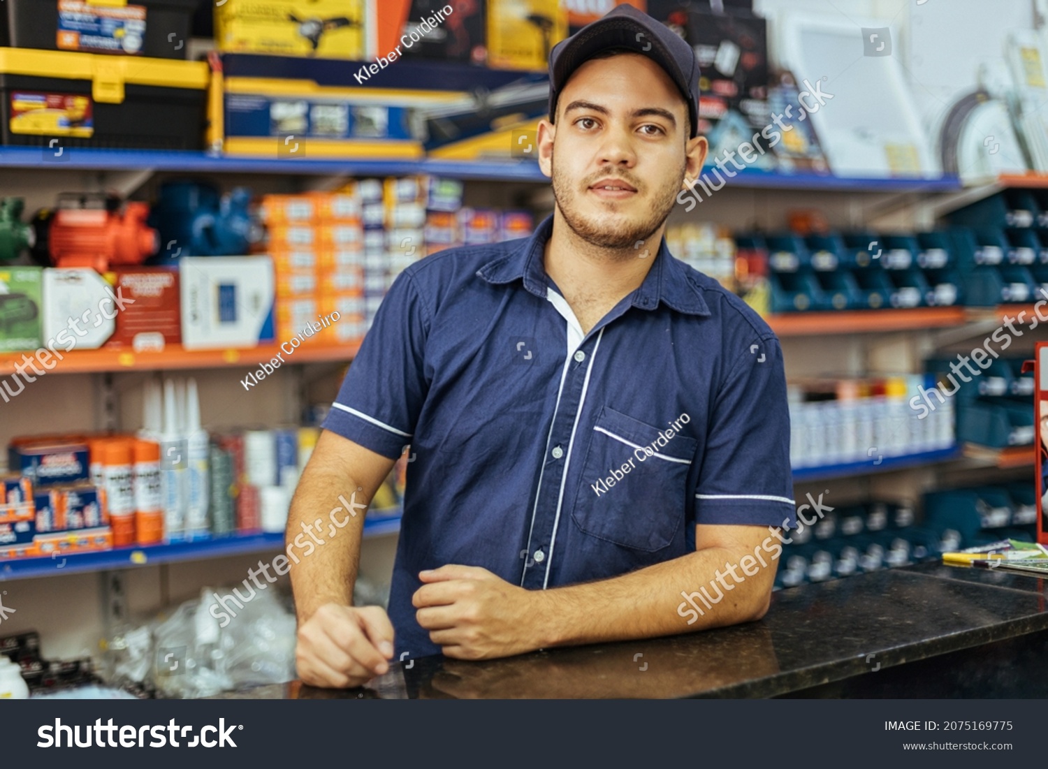 Young latin man working in hardware store #2075169775