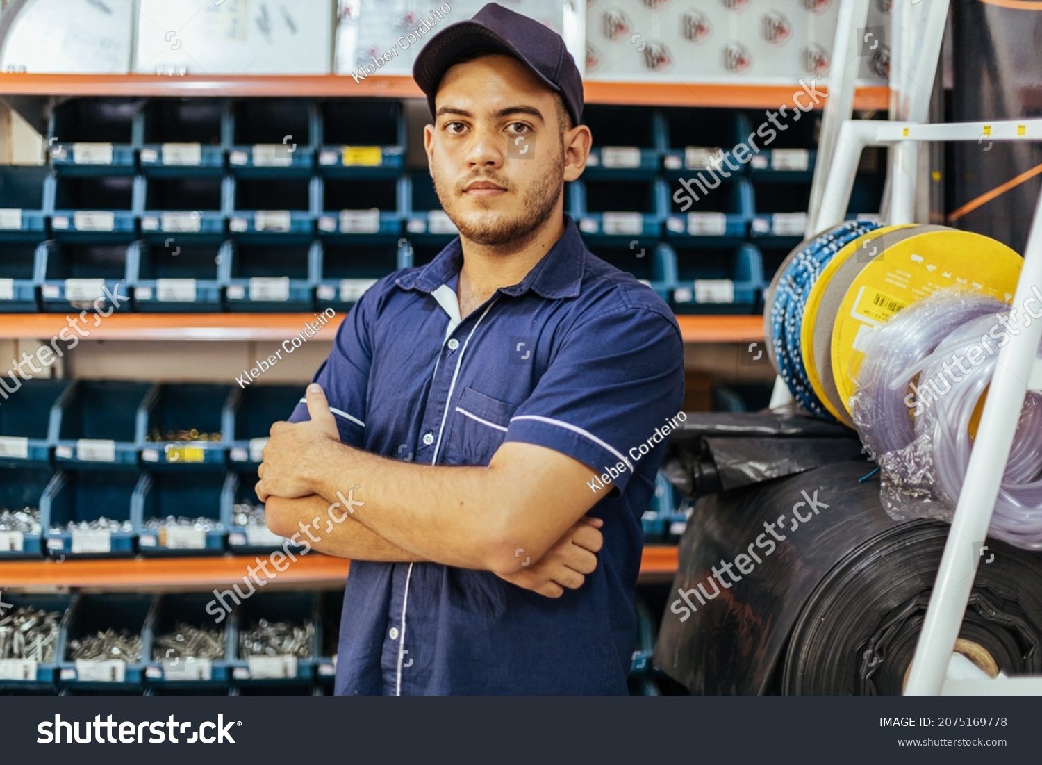 Young latin man working in hardware store #2075169778