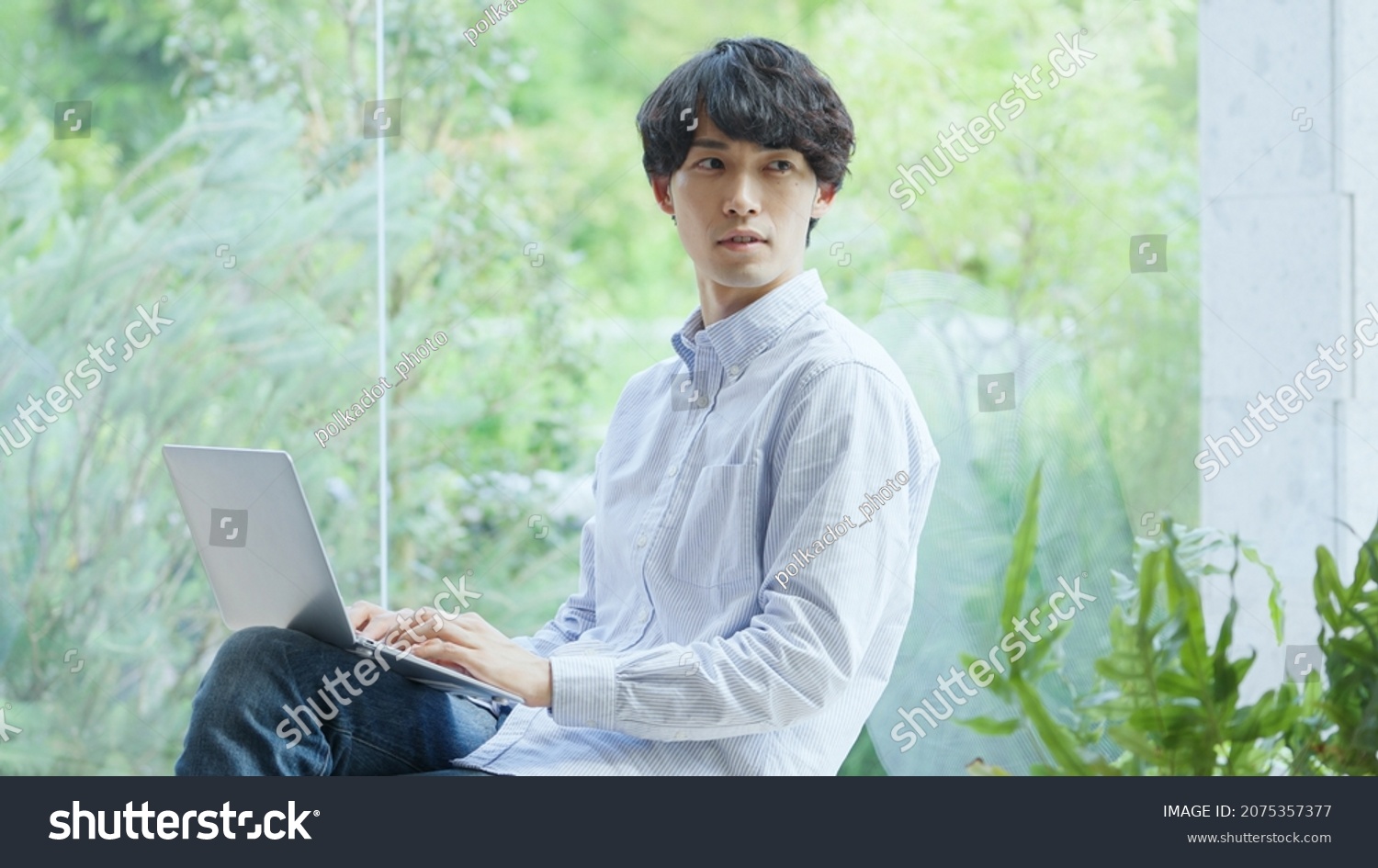 Asian young man working with a computer #2075357377