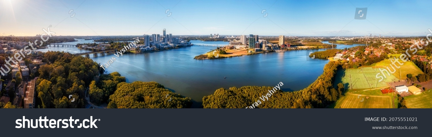 Sydney city CBD to Parramatta CBD wide aerial panorama over Parramatta river in Meadowbank. #2075551021