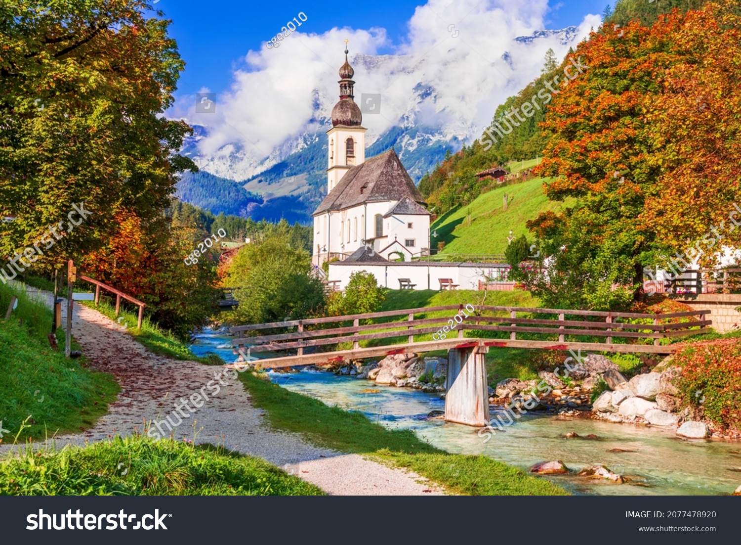Ramsau bei Berchtesgaden, Germany. Autumnal scenery of Ramsau National Park in Berchtesgadener Land in Bavaria with incredible seasonal view of Parish Church of St. Sebastian and River Ramsauer Ache. #2077478920