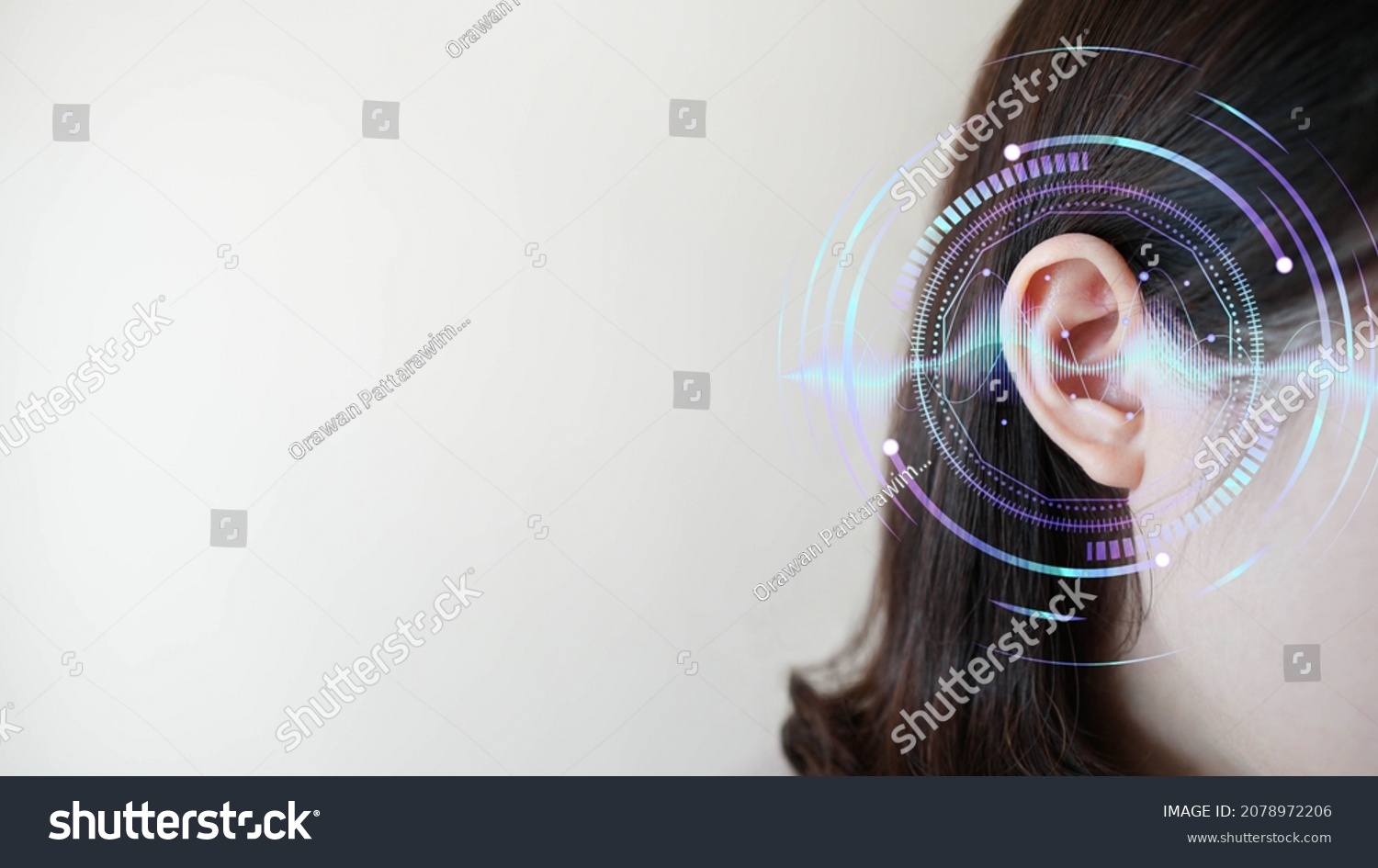 Ear of young woman with sound waves simulation technology. Concept of hearing test, hearing aids, ear disorders and health care. #2078972206