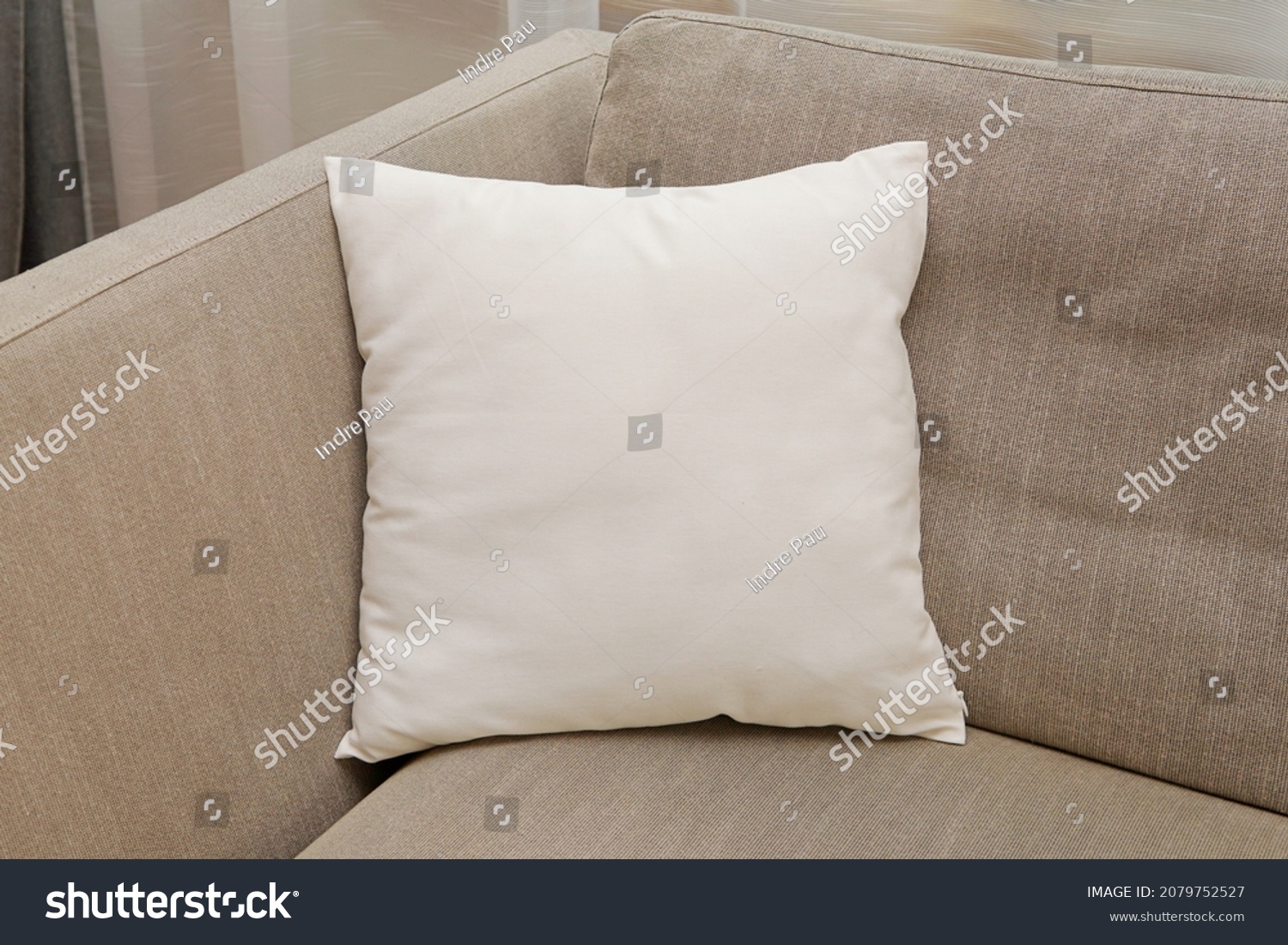 White square canvas pillow mockup on cozy couch, small cotton cushion mockup in living room interior., space for design presentation. #2079752527