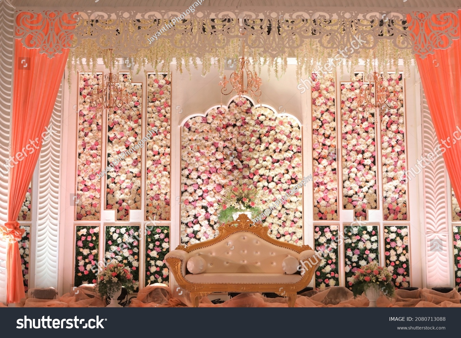 stage decoration with flowers an Indian traditional wedding setup #2080713088