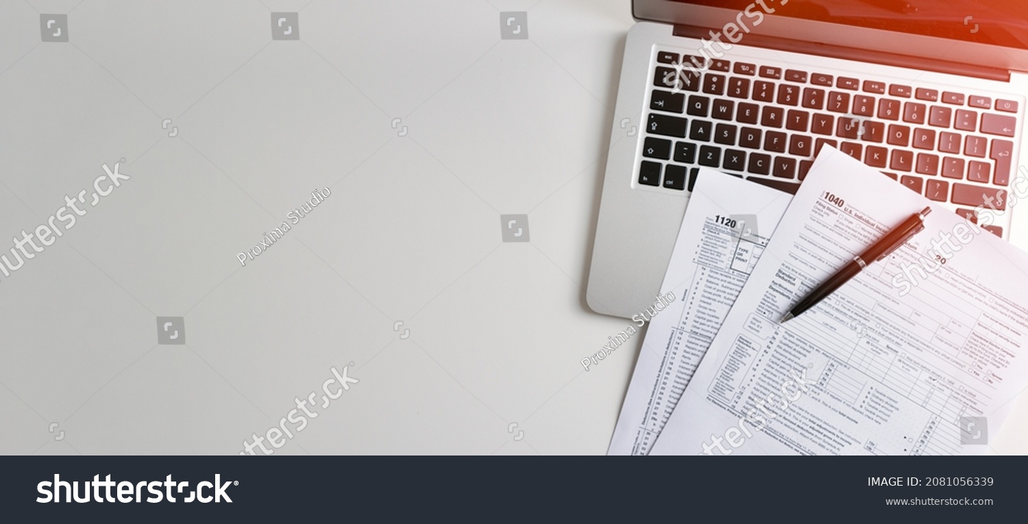 US Individual income tax return. US tax forms on desk. Wide image with copy space #2081056339