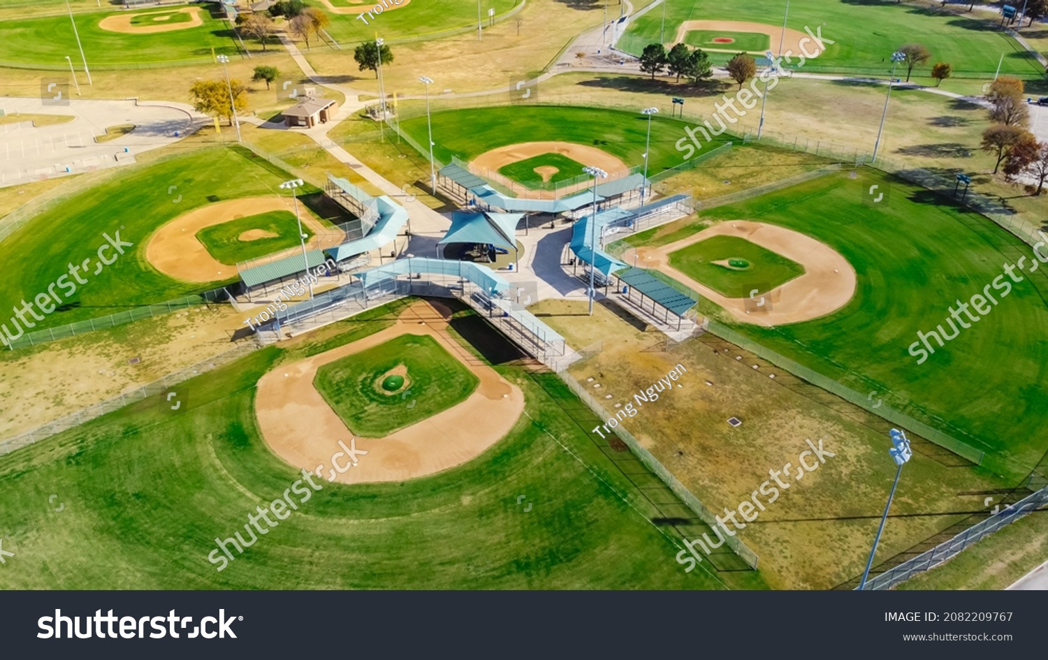 Aerial view huge baseballsoftball complex with natural grass fields, ticket offices, batting cages, pavilion, spectator seating Dallas, TX. Large sport facility venue for practice, tournaments #2082209767