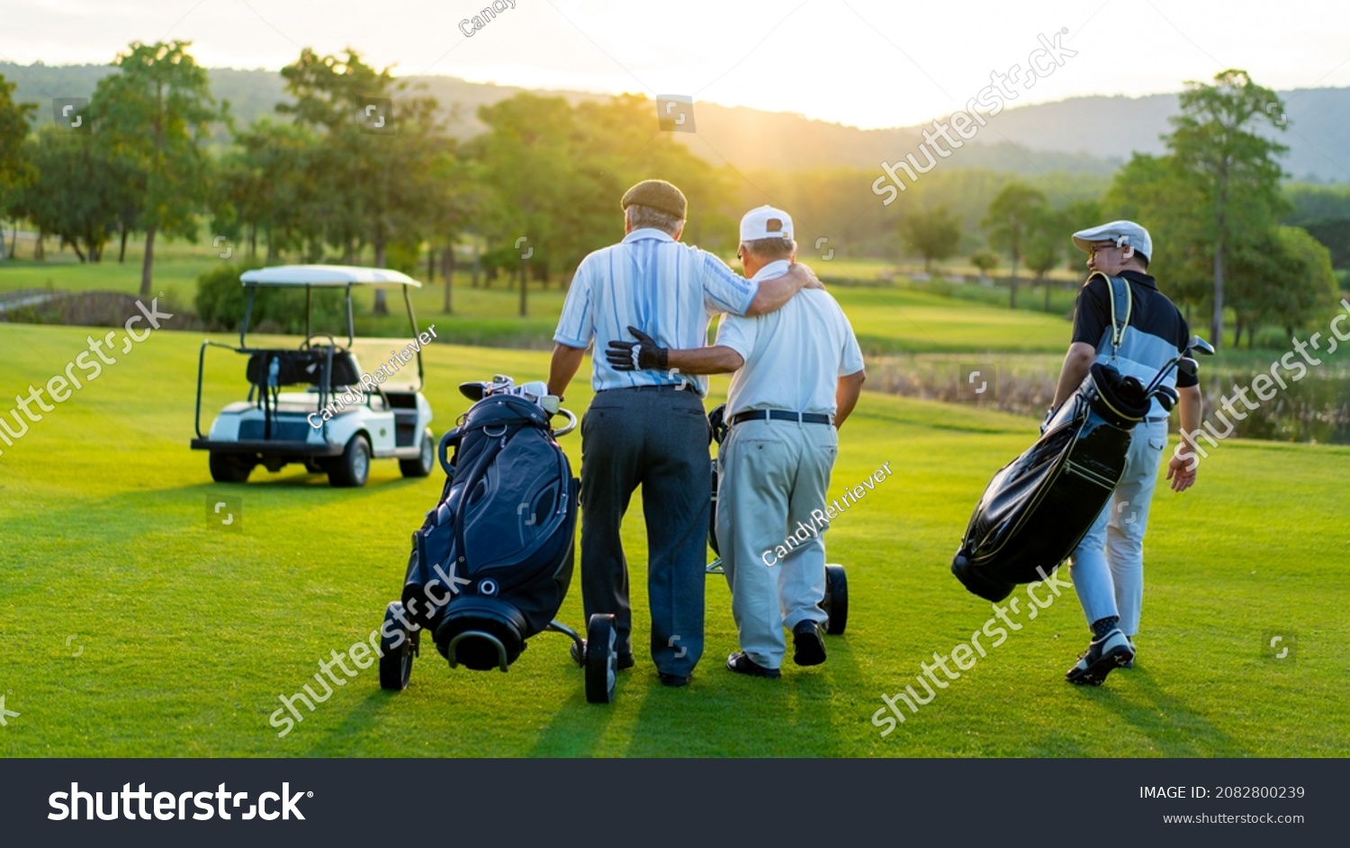 Group of Asian people businessman and senior CEO enjoy outdoor sport  golfing together at country club. Healthy men golfer holding golf bag walking on fairway with talking together at summer sunset #2082800239