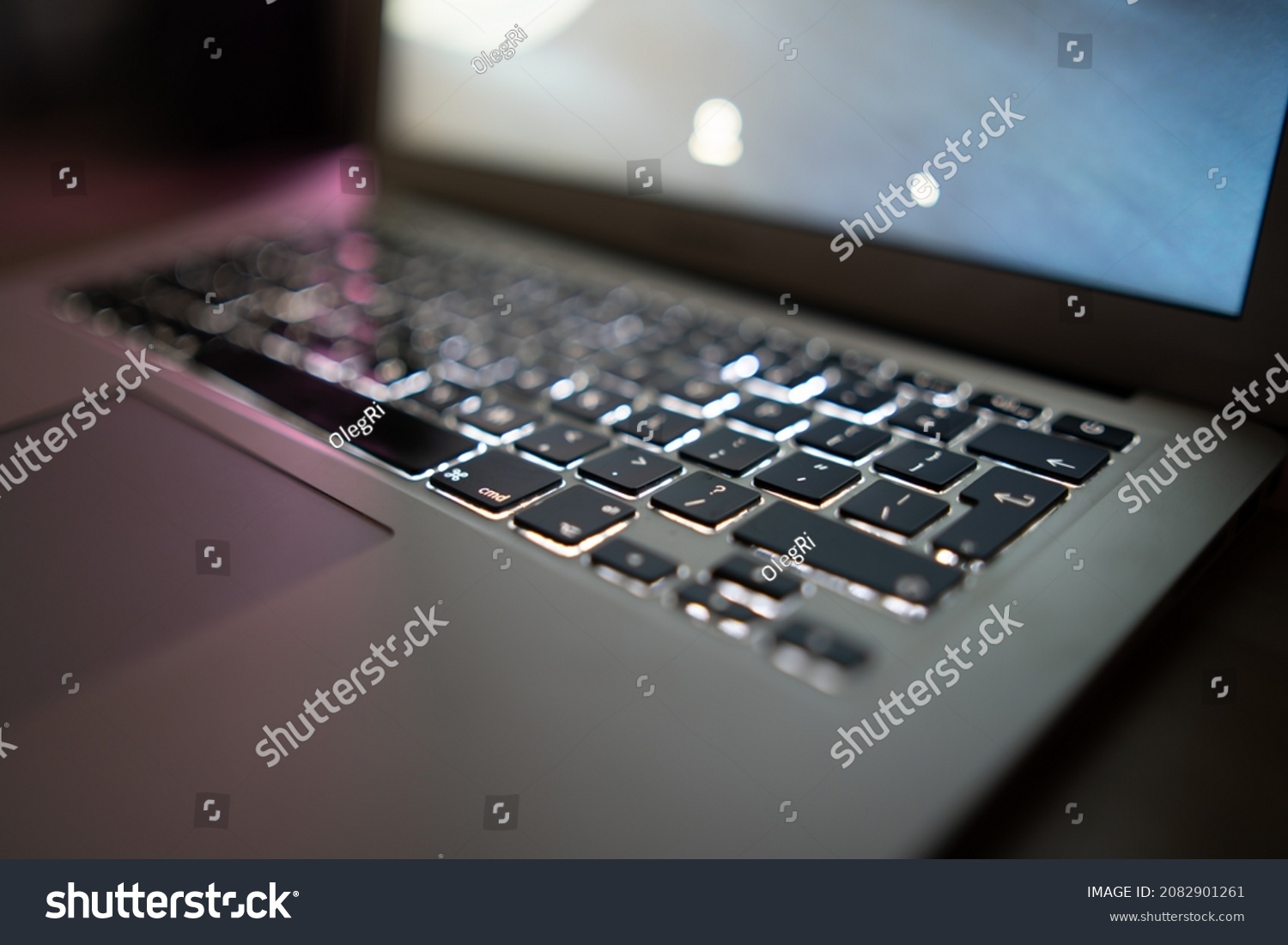 Close up of laptop keyboard colorful neon illumination, backlit keyboard. #2082901261