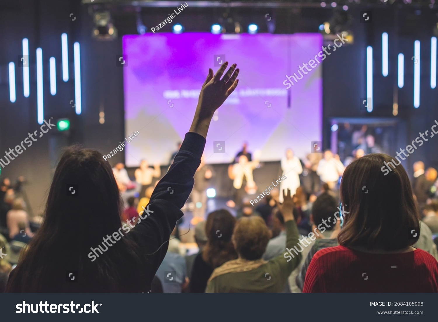 Hands in the air of people who praise God at church service #2084105998