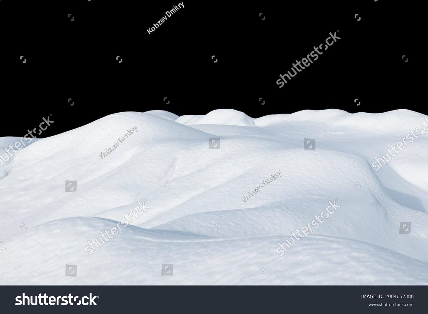 Snow drifts on a black isolated background. Snowy landscape of the hills of the North. Winter season. #2084652388