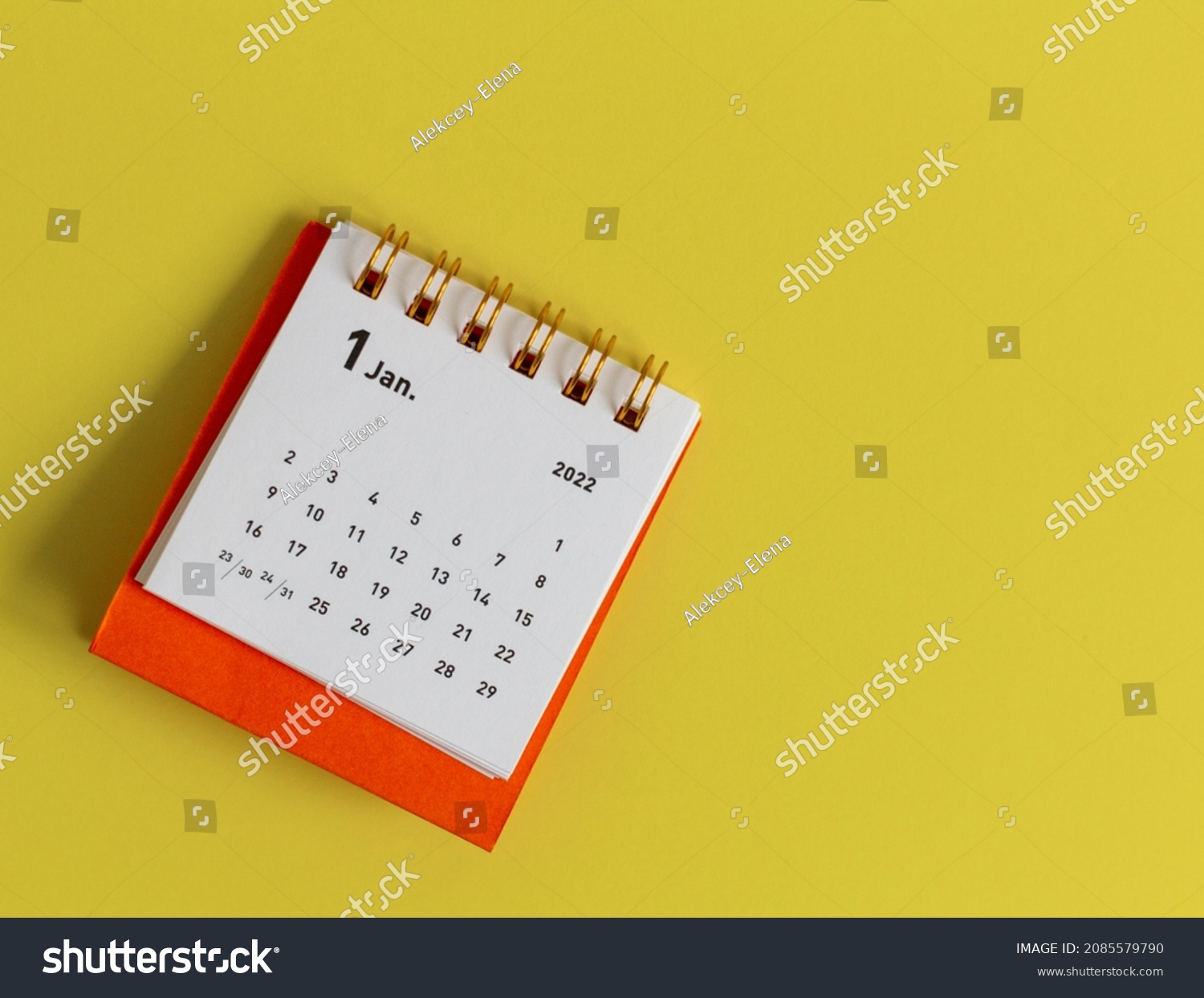 Desktop calendar for January 2022 on a yellow background. #2085579790