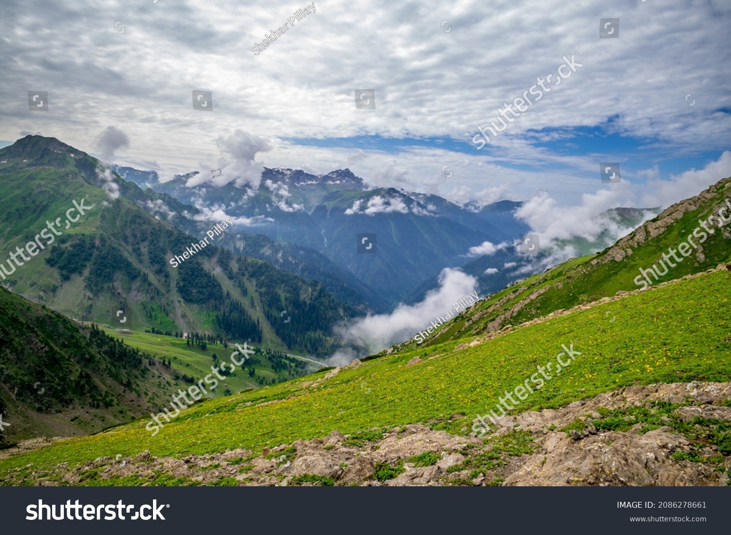 Landscape with mountains and clouds. Panoramic view of Kashmir valley in the Himalayan region. Serene meadows alpine trees, wildflowers on the trails Kashmir Great Lakes Trek, Sep .2021 India . #2086278661