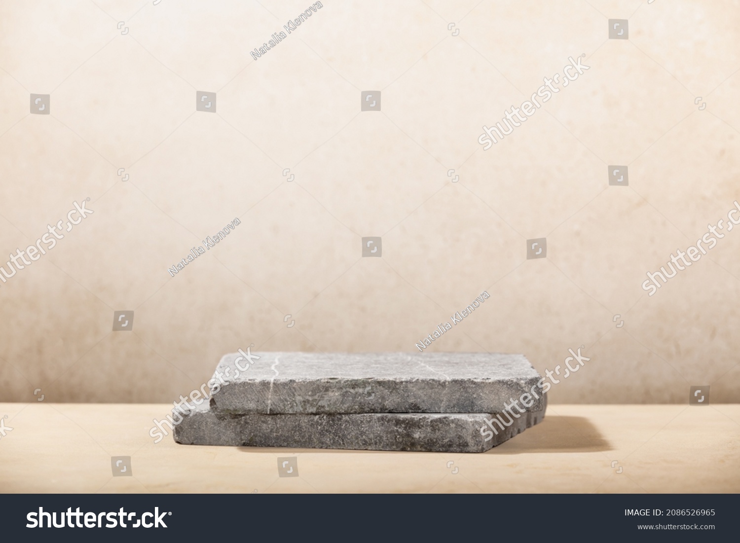 Monochrome beige template for mockup, banner. Flat granite pedestal on beige background. Stone stand for natural design concept. Horizontal image, center composition, hard light, front view #2086526965