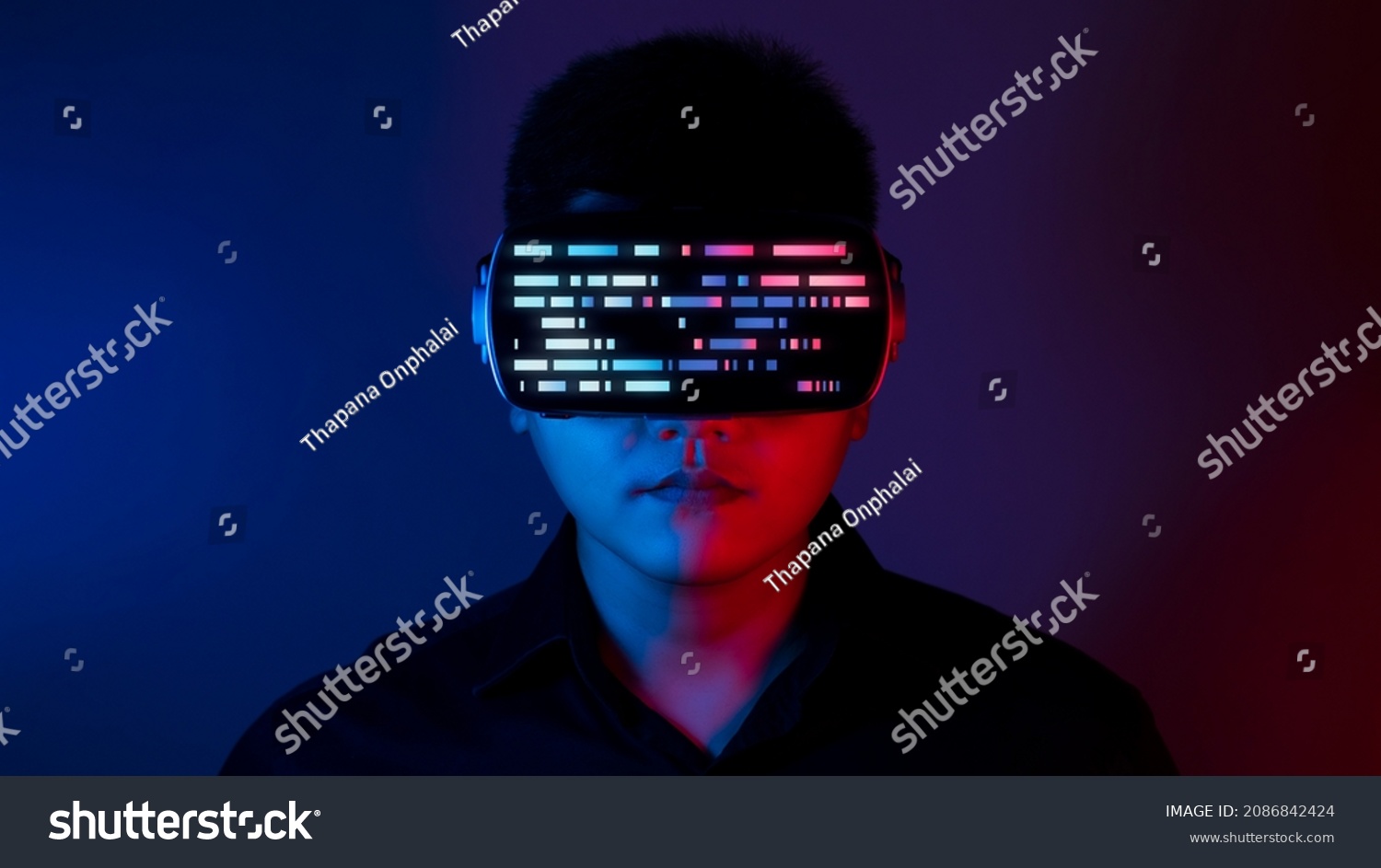 Young man wearing VR goggles. Metaverse technology virtual reality concept. Virtual Reality Device, Simulation, 3D, AR, VR, Innovation and Technology of the Future on Social Media. #2086842424