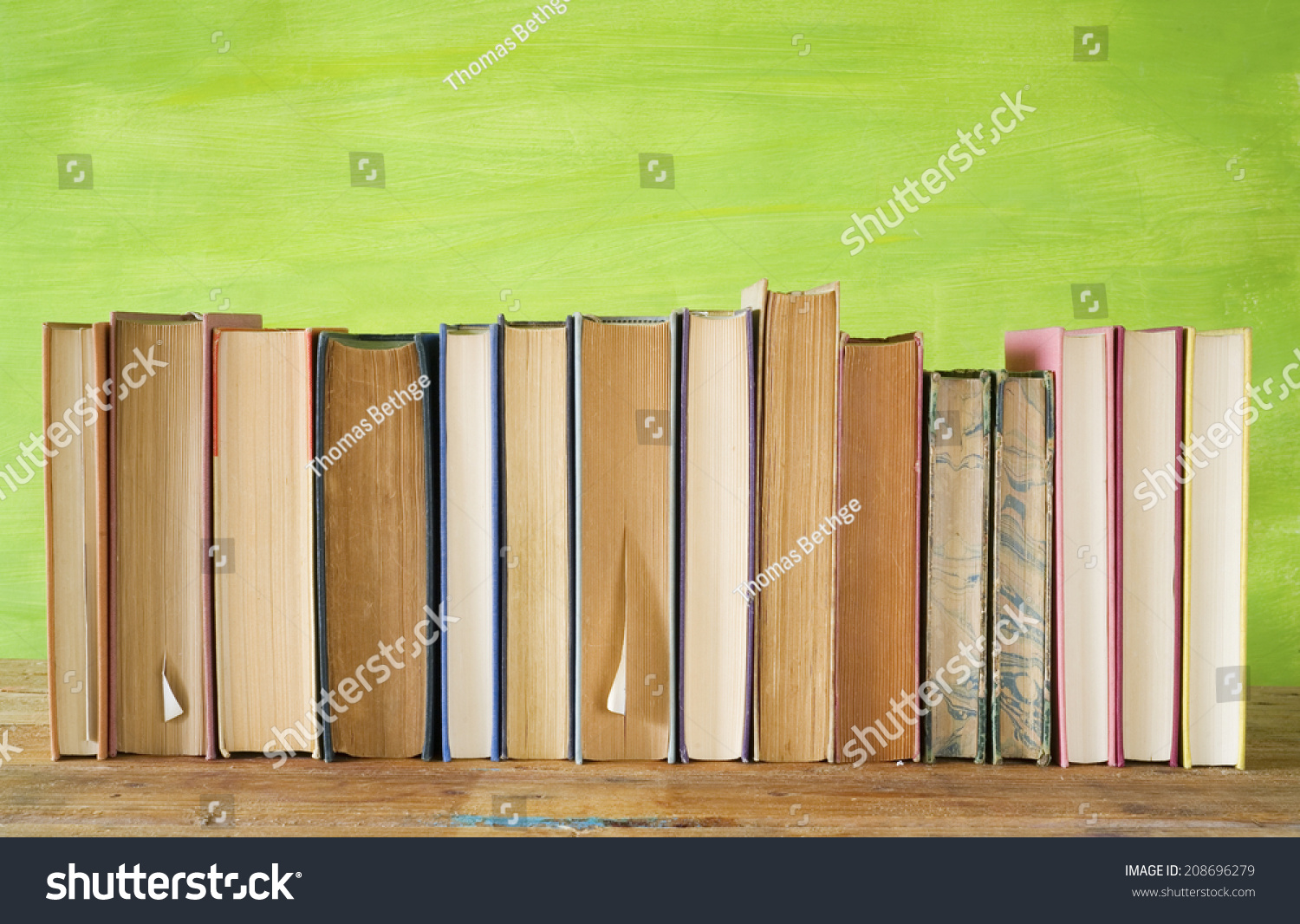 row of books, grungy background, free copy space  #208696279