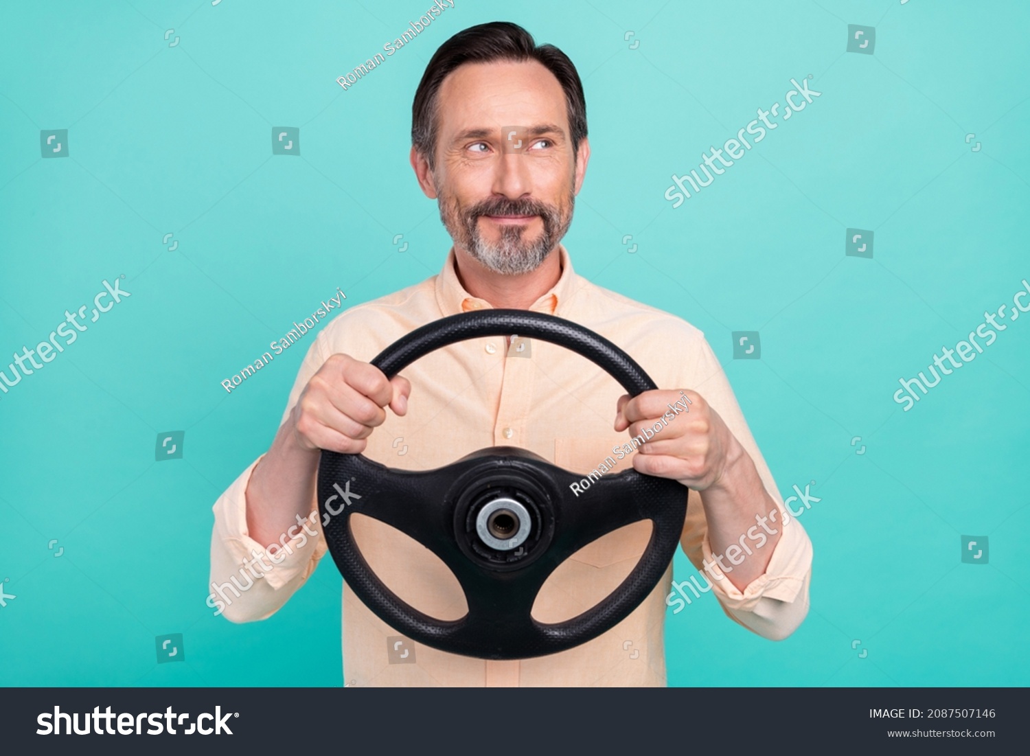 Photo of nice age man drive look empty space wear peach shirt isolated on teal color background #2087507146