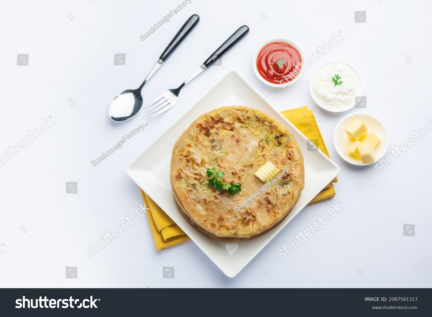Aloo paratha or gobi paratha also known as Potato or Cauliflower stuffed flatbread dish originating from the Indian subcontinent #2087561317