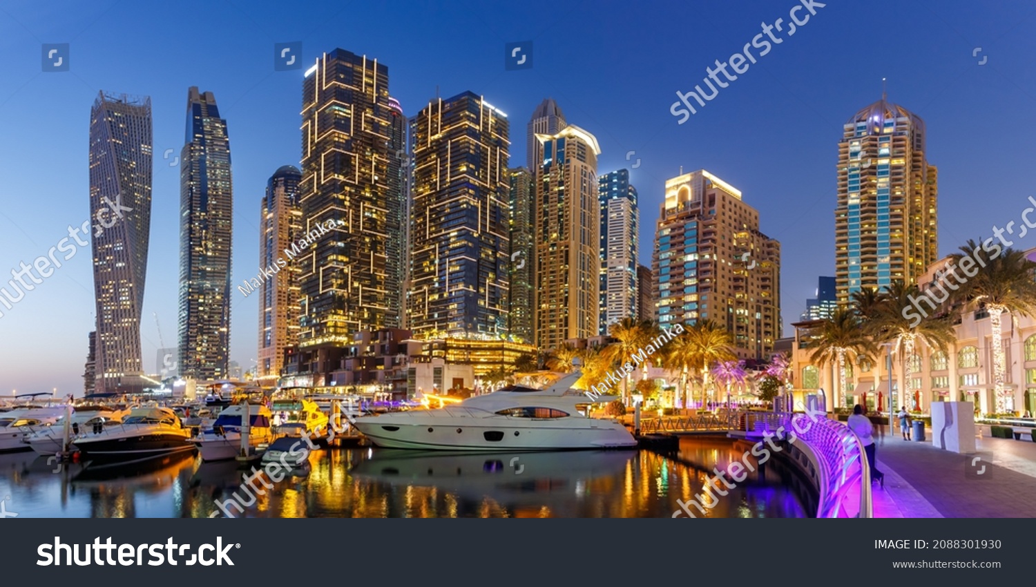 Dubai Marina and Harbour skyline architecture wealth luxury travel with yacht boat at night panorama in United Arab Emirates modern #2088301930