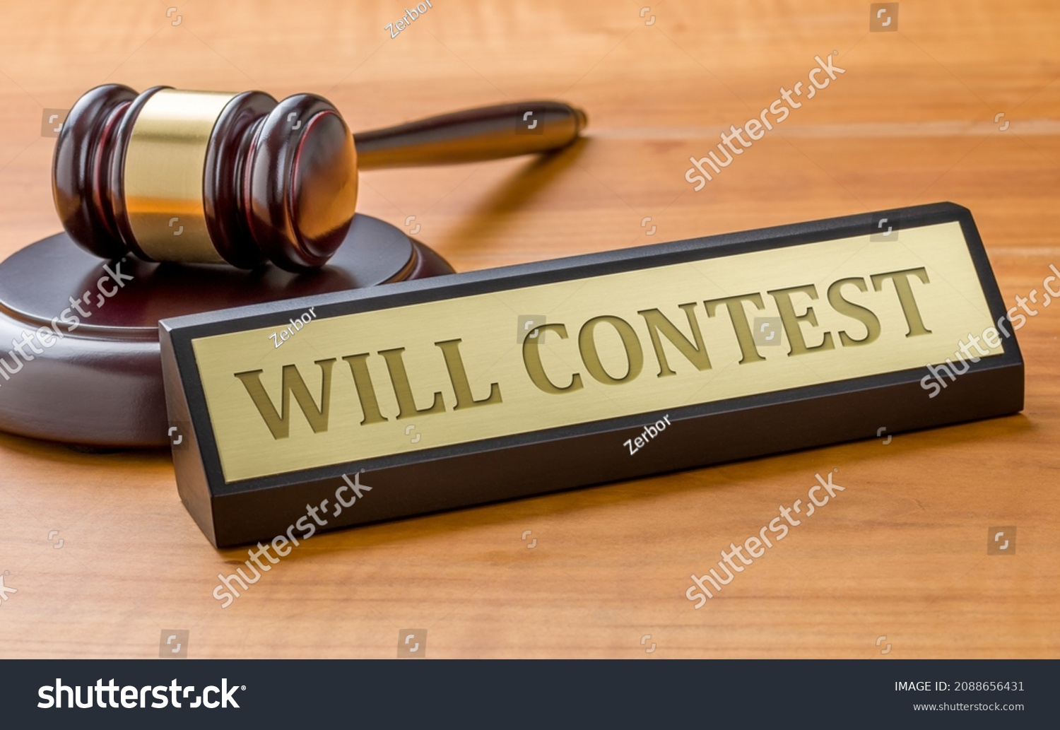 A gavel and a name plate with the engraving Will contest #2088656431