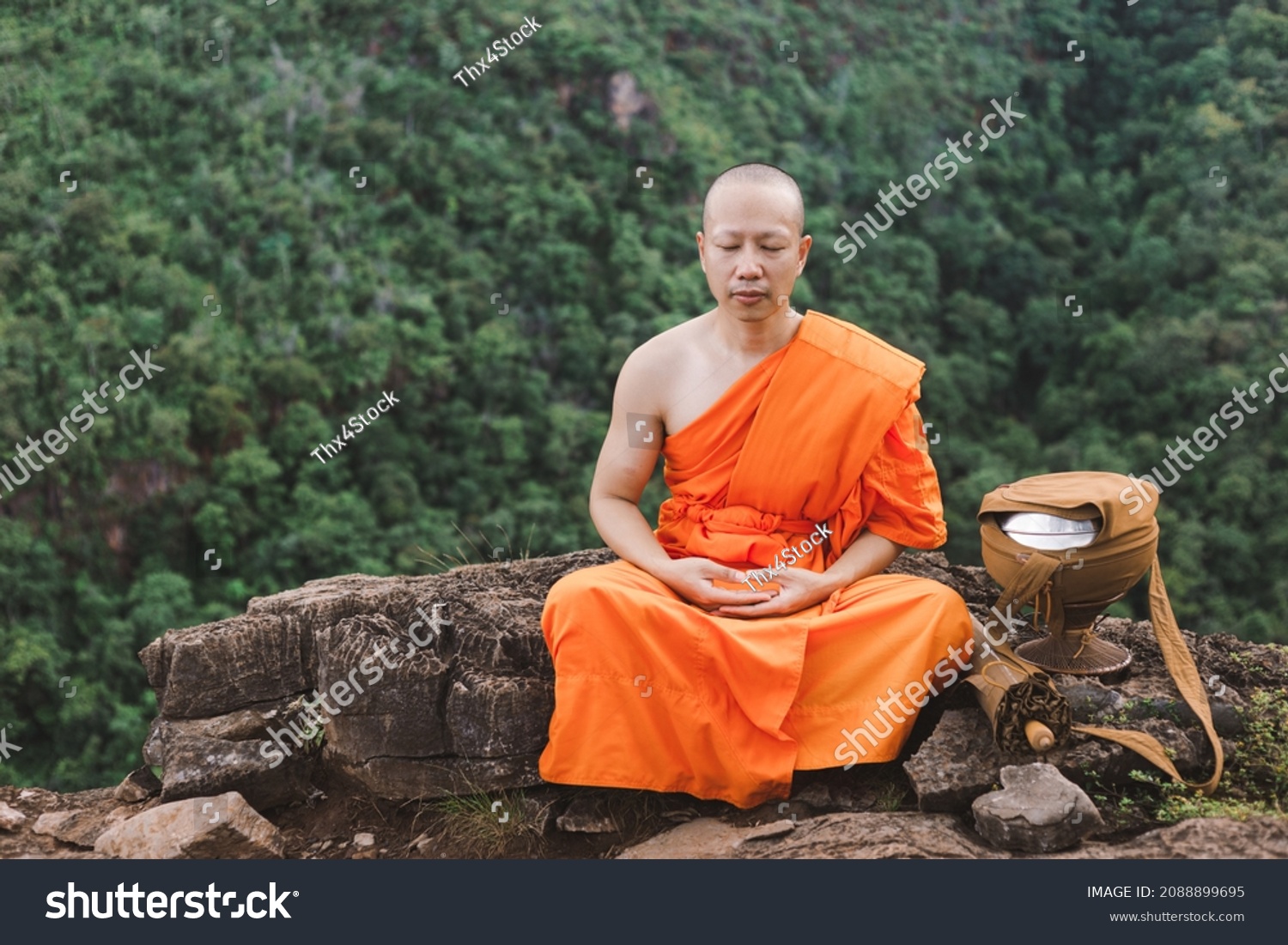 Monk meditating on top of a mountain,Purify the mind, Religious concept. #2088899695