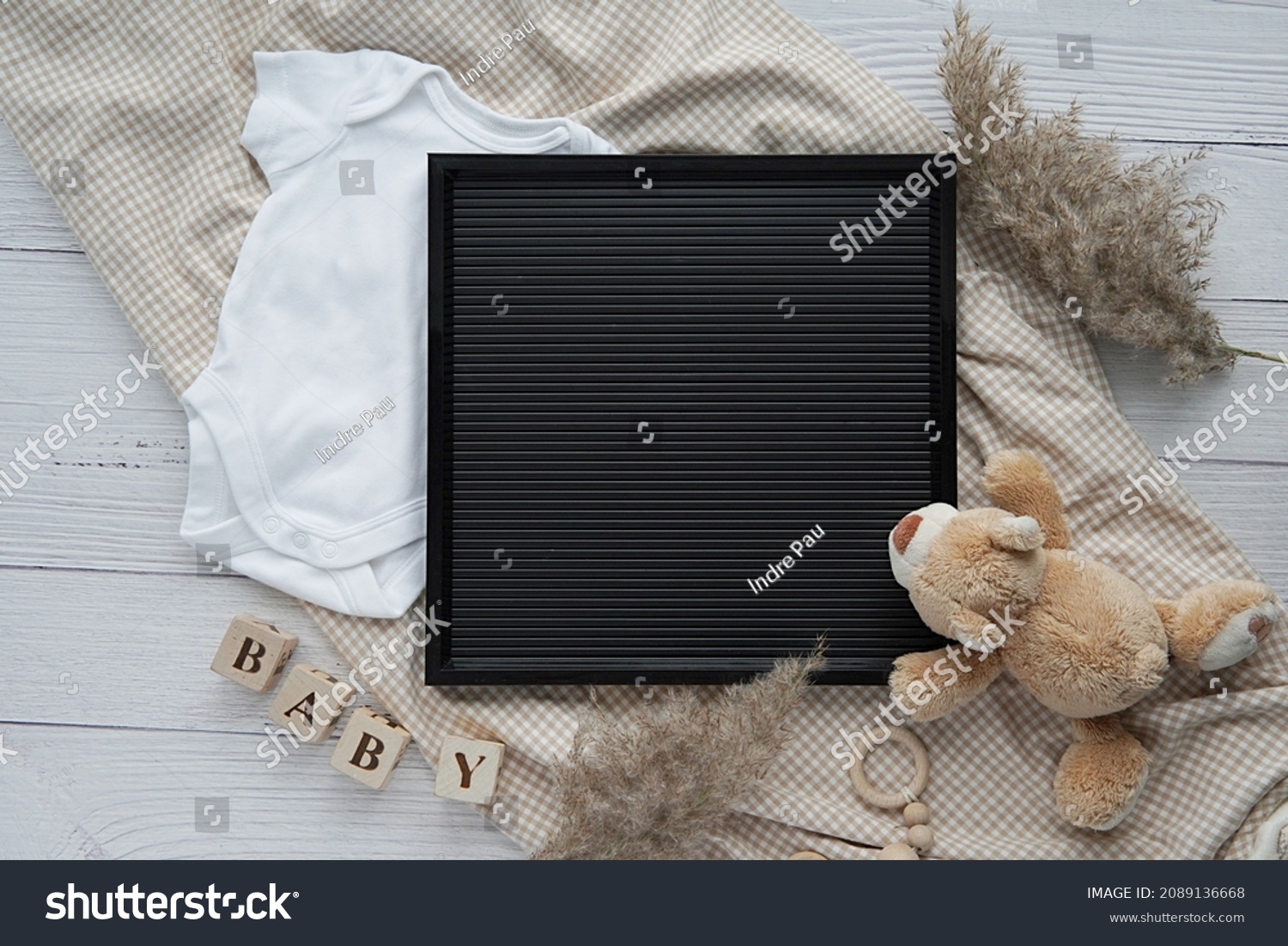 Black letterboard mockup, baby bodysuit, toys, pampas grass, blanket, pregnancy announcement, baby waiting. #2089136668