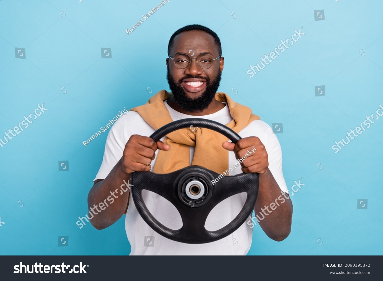 Photo of cheerful auto rider hold steering wheel wear white t-shirt jumper front-tie isolated blue color background #2090195872