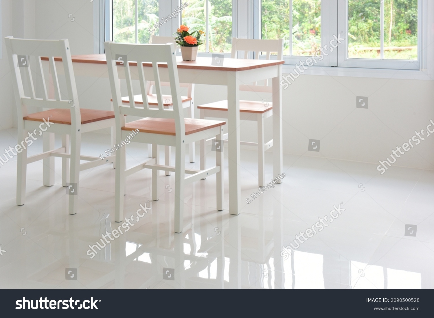 white room, glossy tiled floor with wooden table and chair set.  #2090500528