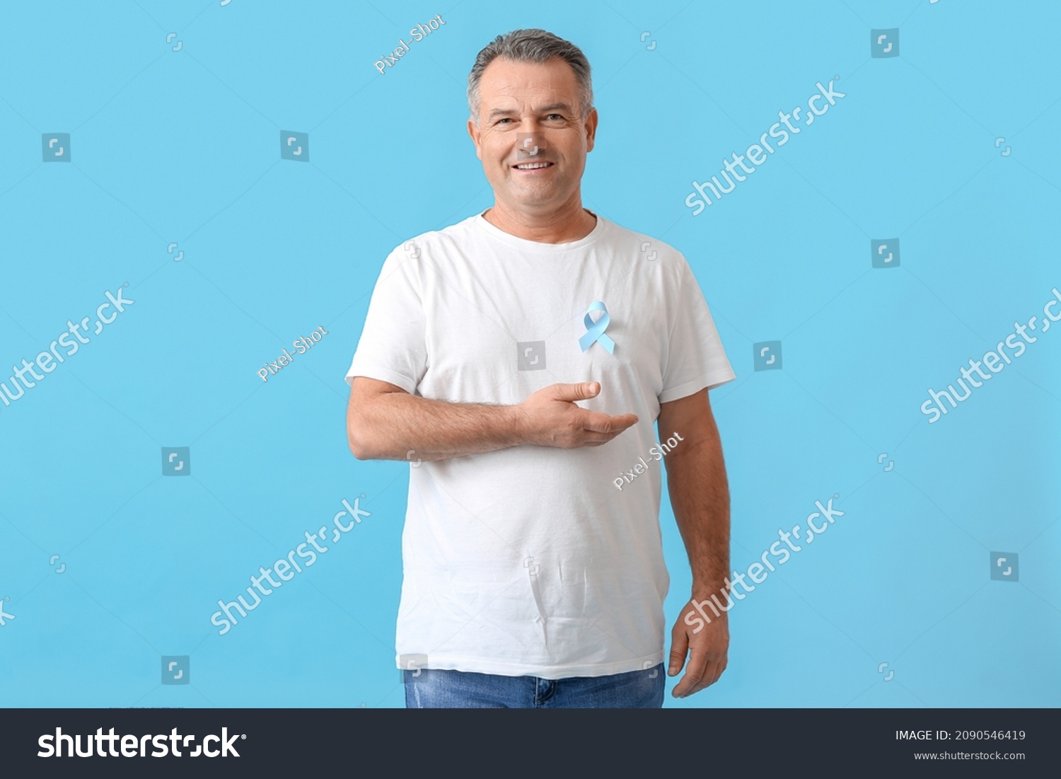 Mature man with blue ribbon on color background. Prostate cancer awareness concept #2090546419