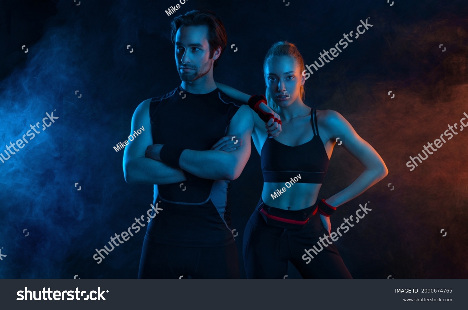Sprinter run. Strong athletic woman and man running on black background wearing in the sportswear. Fitness and sport motivation. Runner concept. #2090674765
