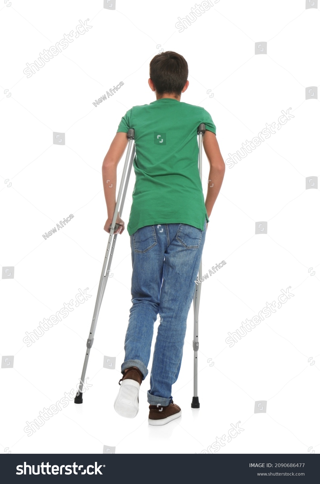 Teenage boy with injured leg using crutches on white background, back view #2090686477