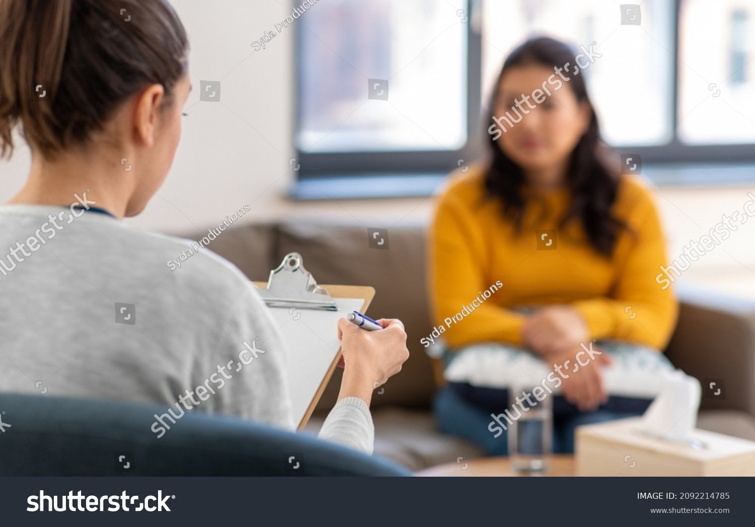 psychology, mental therapy and people concept - close up of woman psychologist and patient at psychotherapy session #2092214785