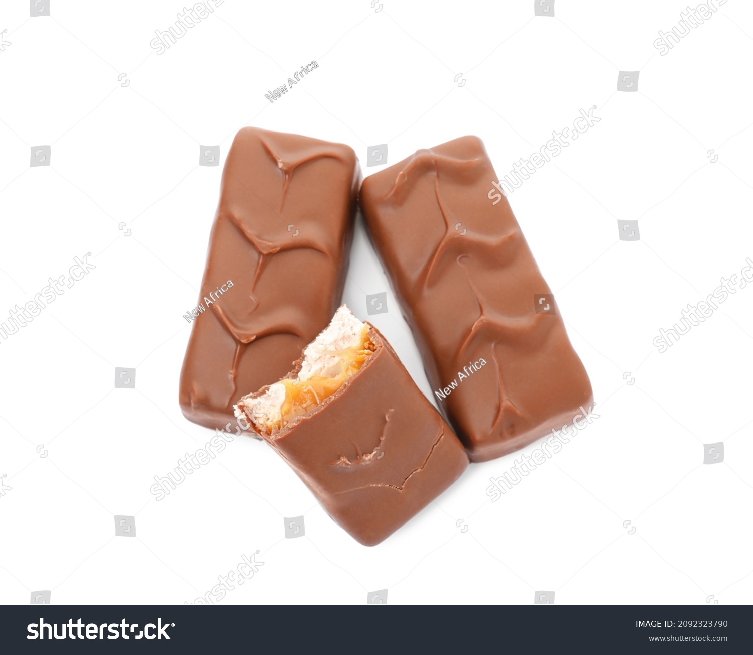 Chocolate bars with caramel, nuts and nougat isolated on white, top view #2092323790