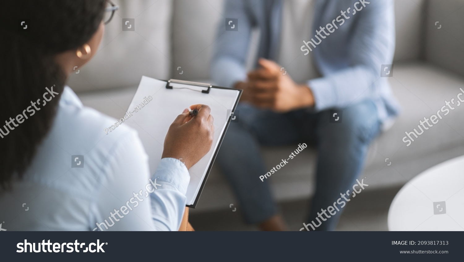 Professional psychotherapy. Female psychologist having session with young male patient at mental health clinic, selective focus. Banner design with copy space. Treatment of depression concept #2093817313
