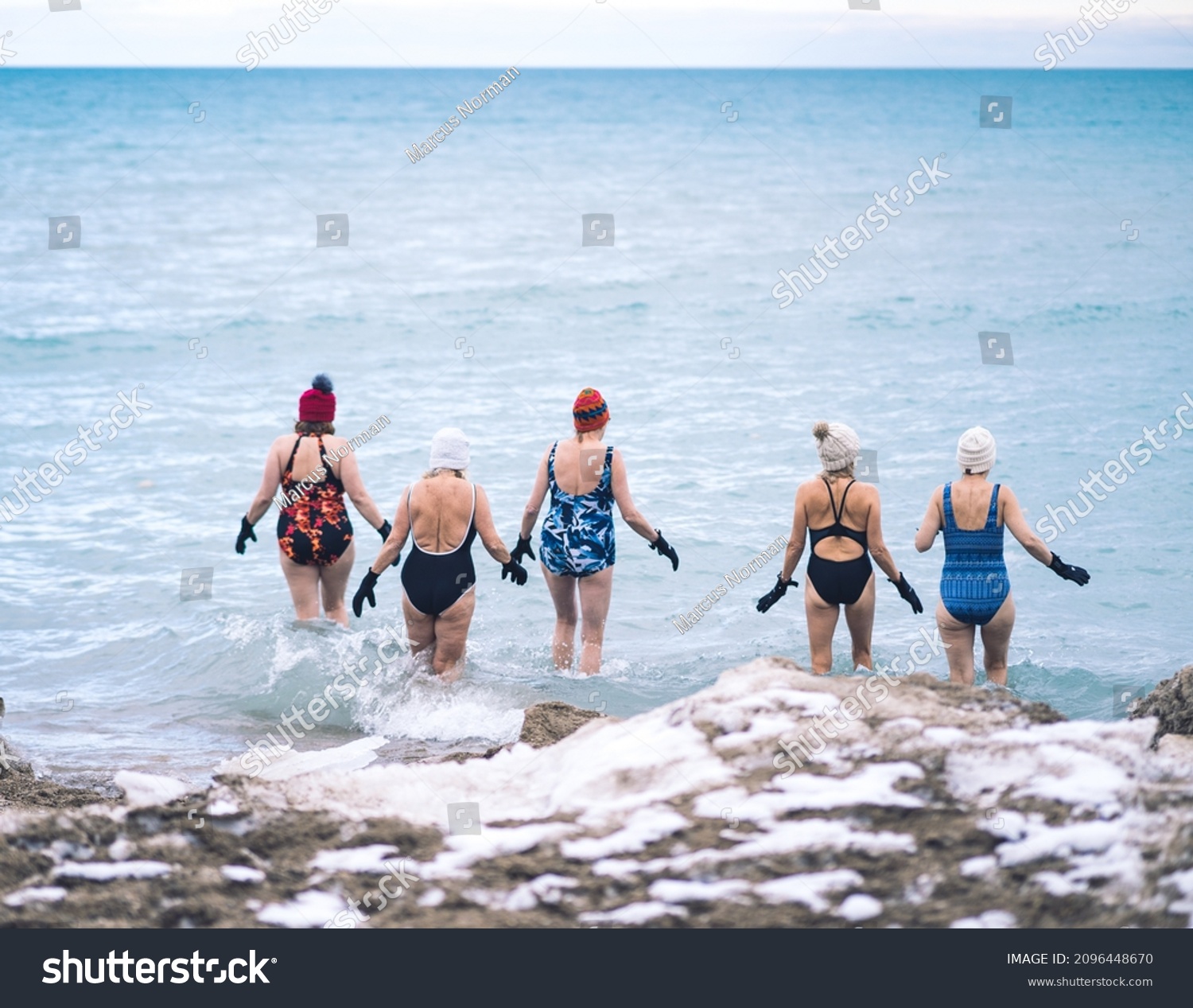 Group of elderly woman taking a winter swim in Lake Michigan #2096448670