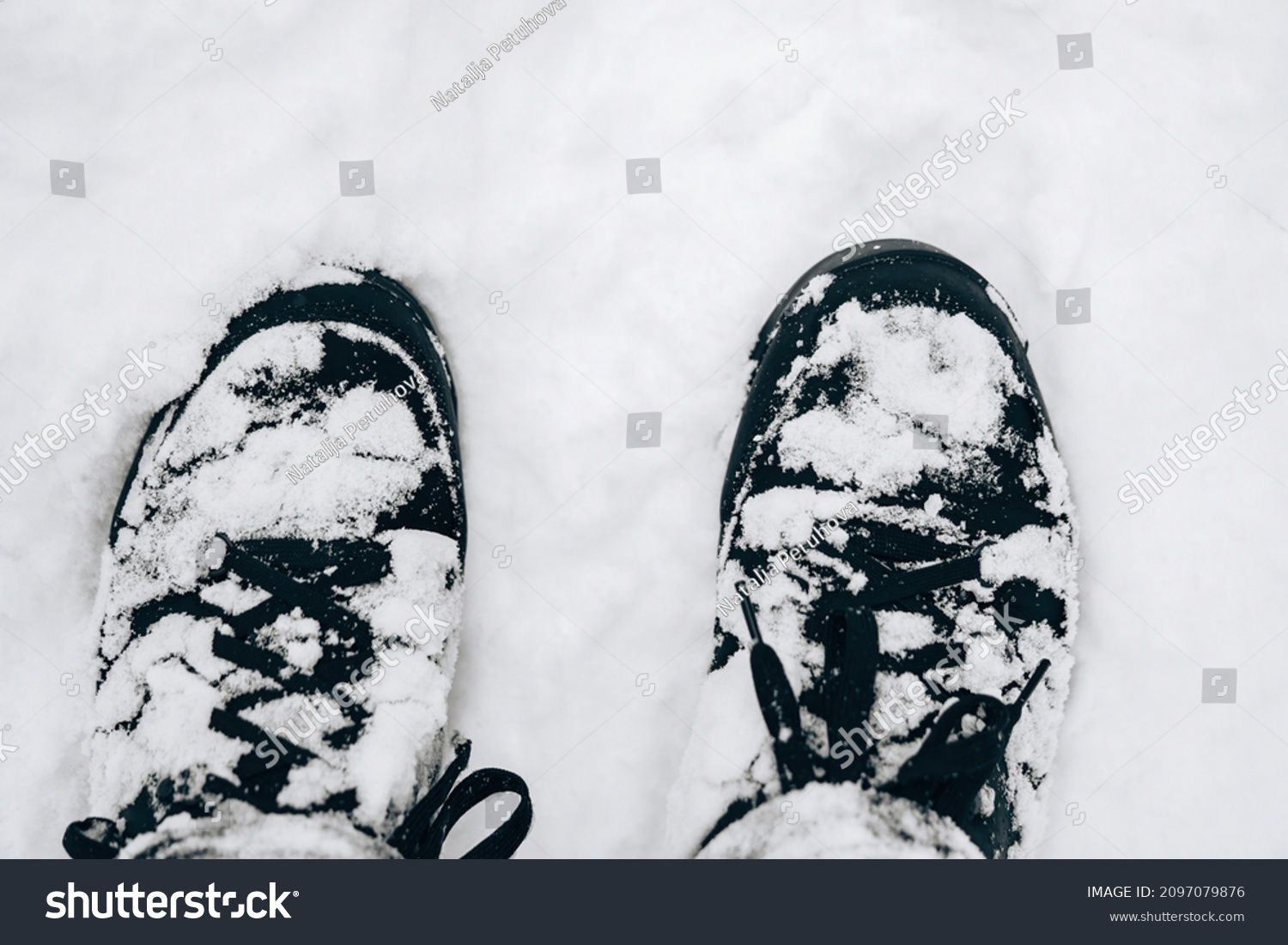 Closeup of hiking boots in the snow. #2097079876