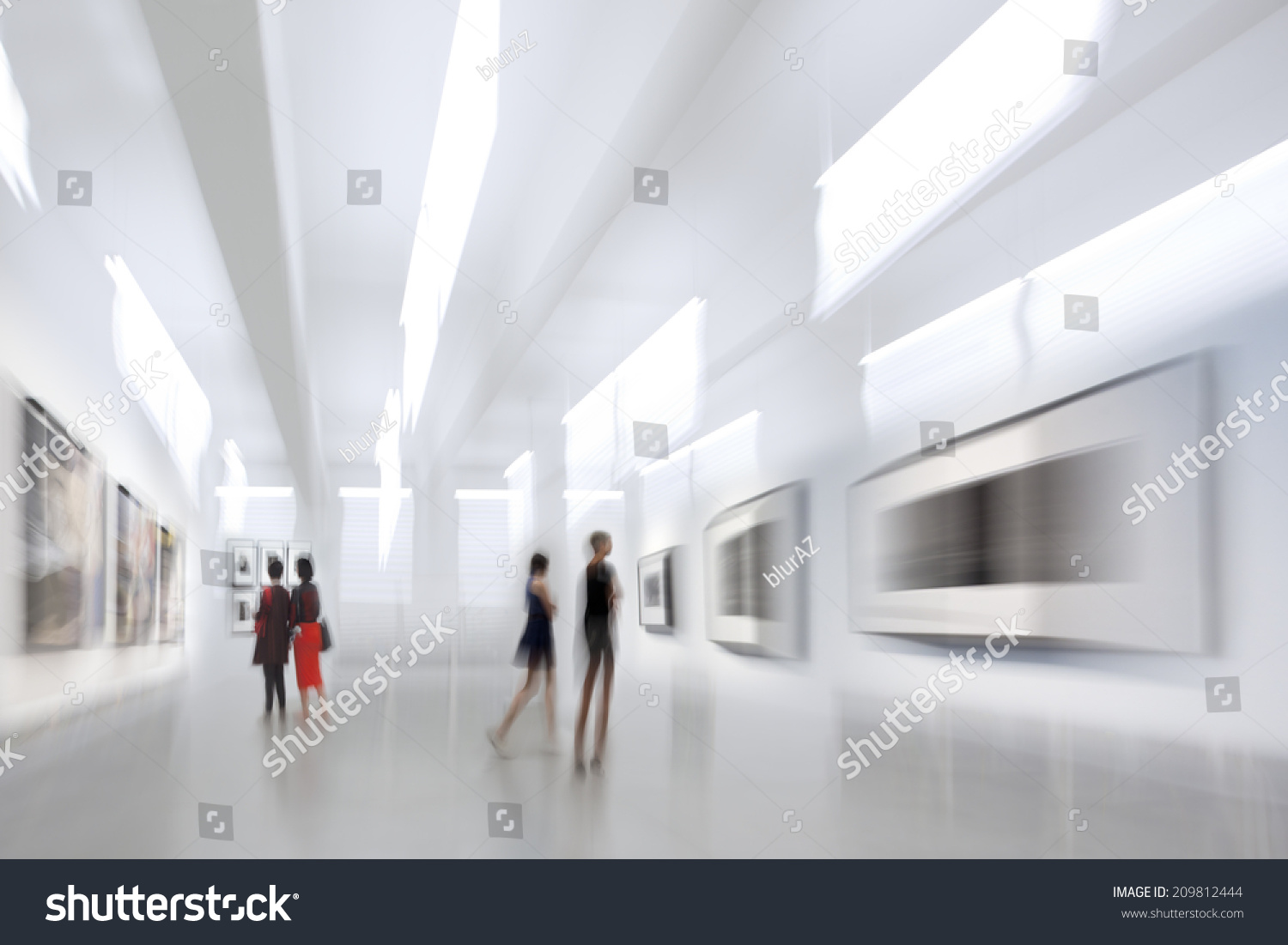 abstract image of people in the lobby of a modern art center with a blurred background #209812444