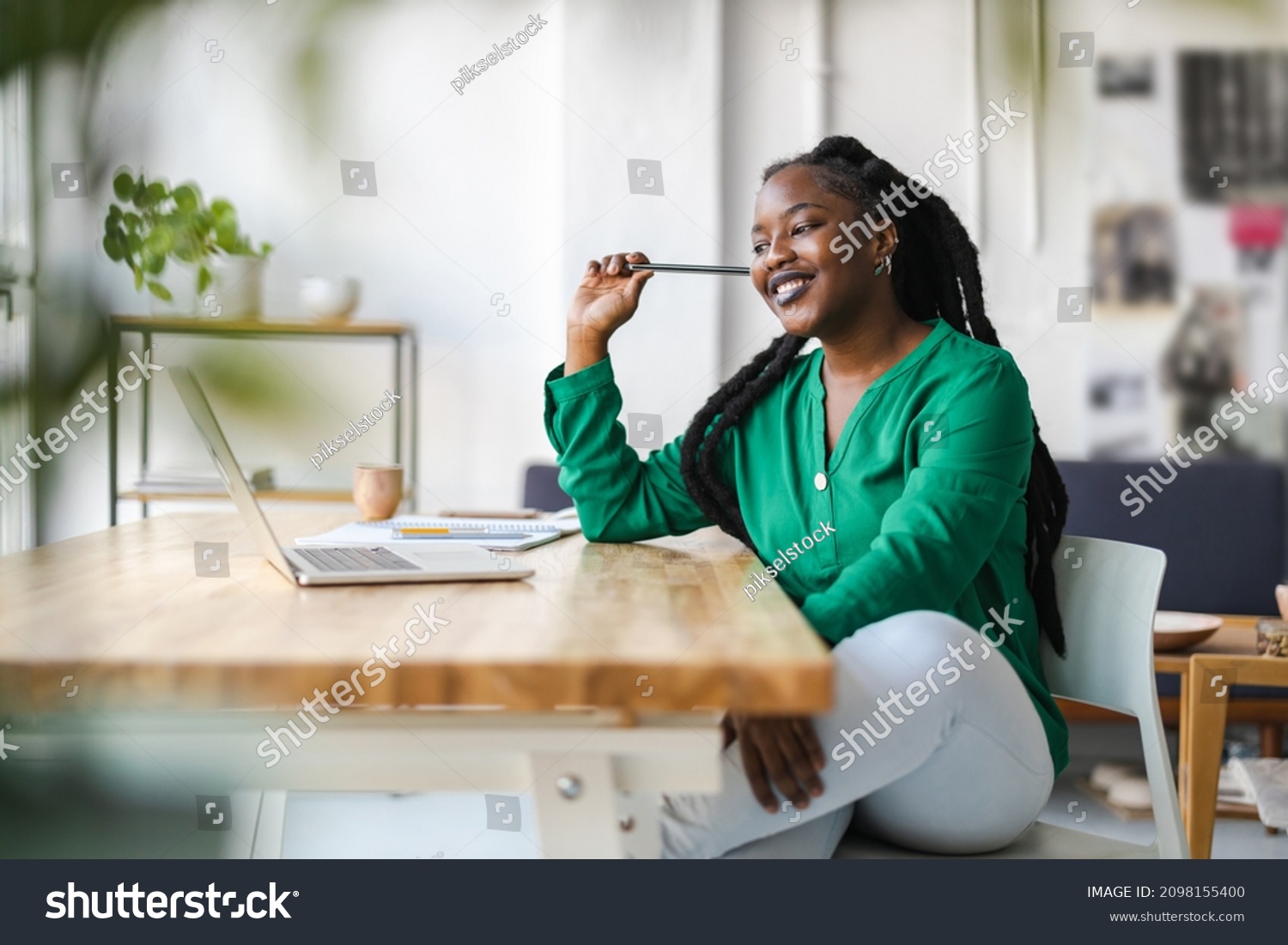 Young adult female professional working in a modern office
 #2098155400