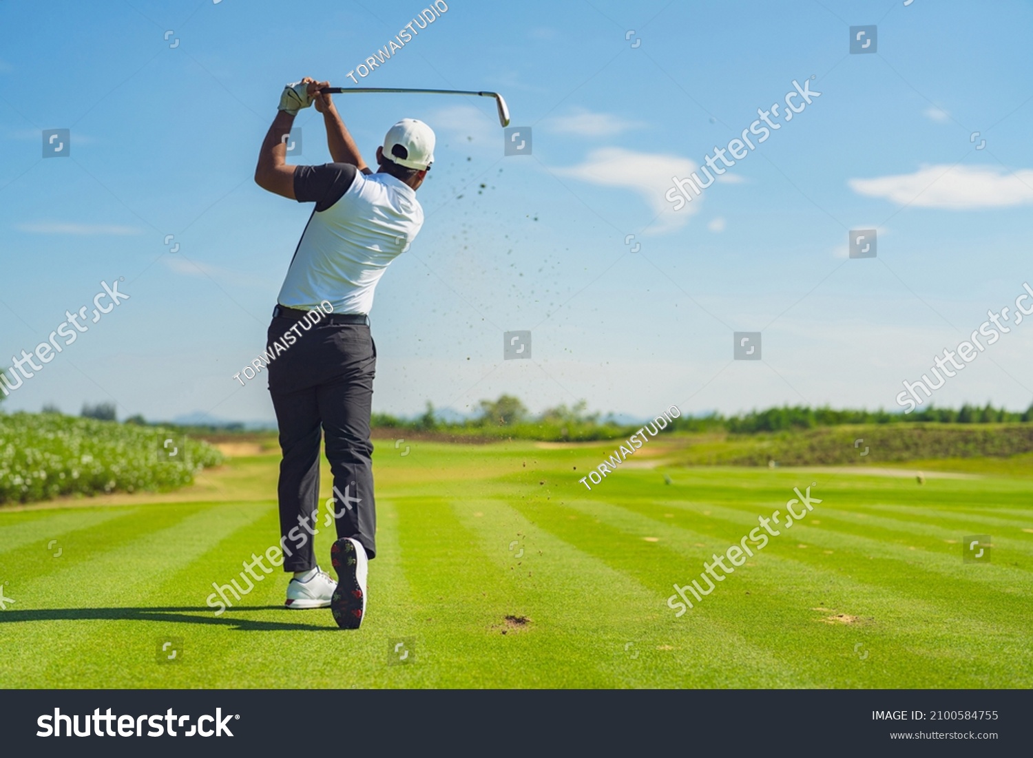 Asian man golfing on the course in summer #2100584755