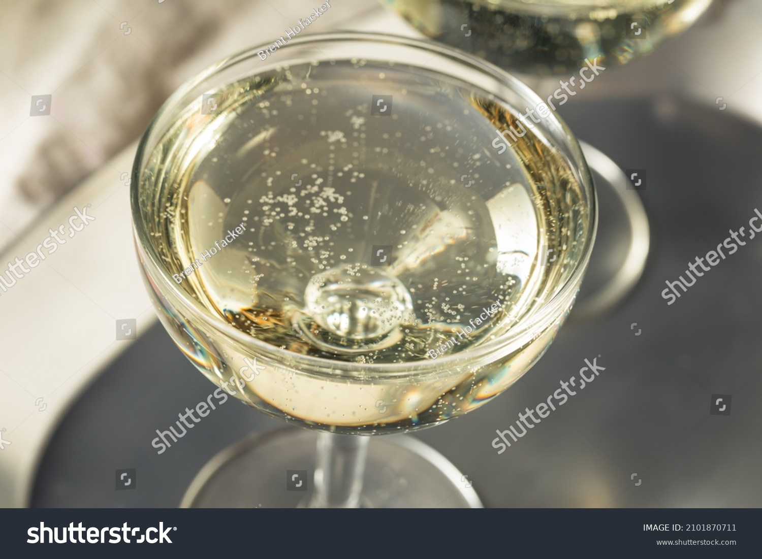 Cold Refreshing Bubbly Champagne in a Coupe Glass for New Years #2101870711