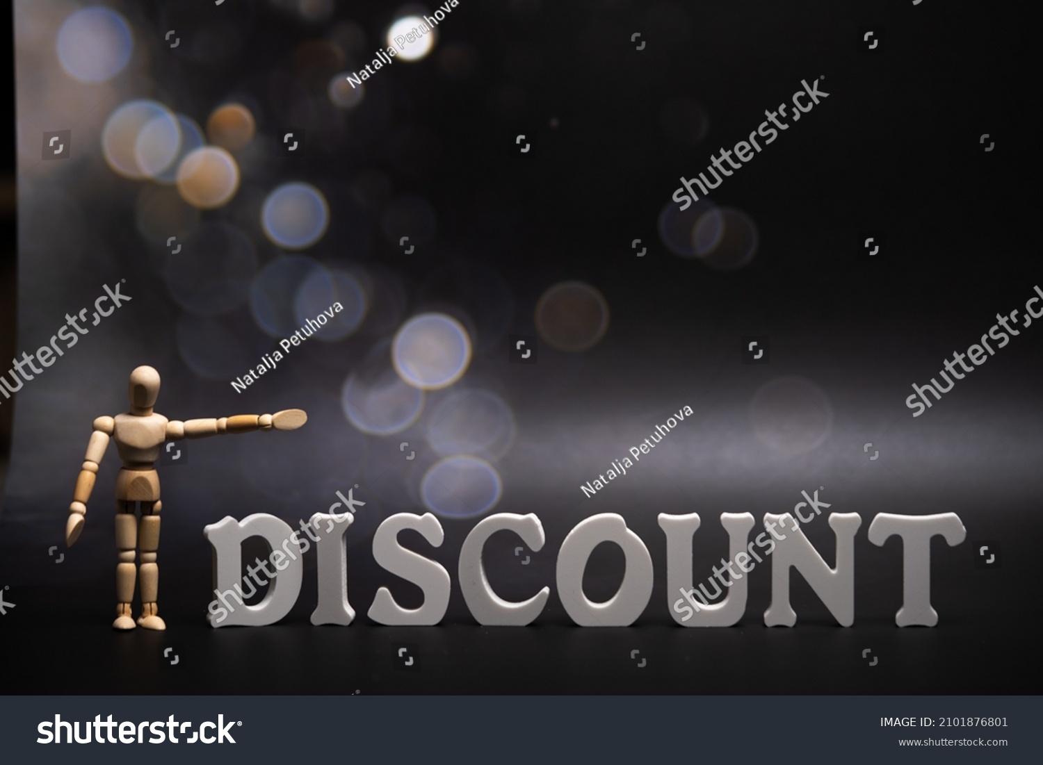 text discount on a dark background with bokeh . #2101876801