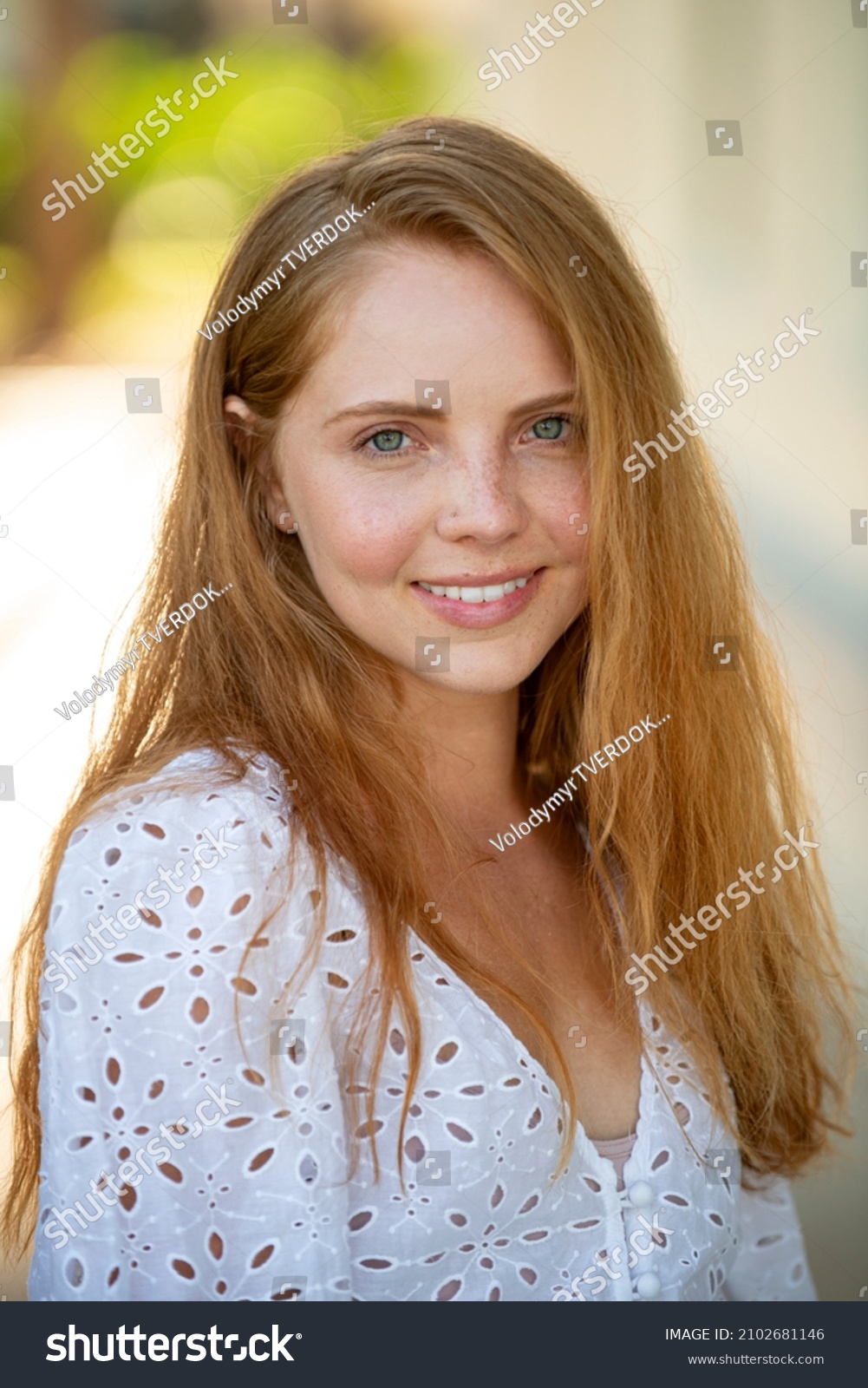 Woman with romantic smile. Close up face of young stylish woman. Beautiful fashionable girl outdoor portrait. #2102681146
