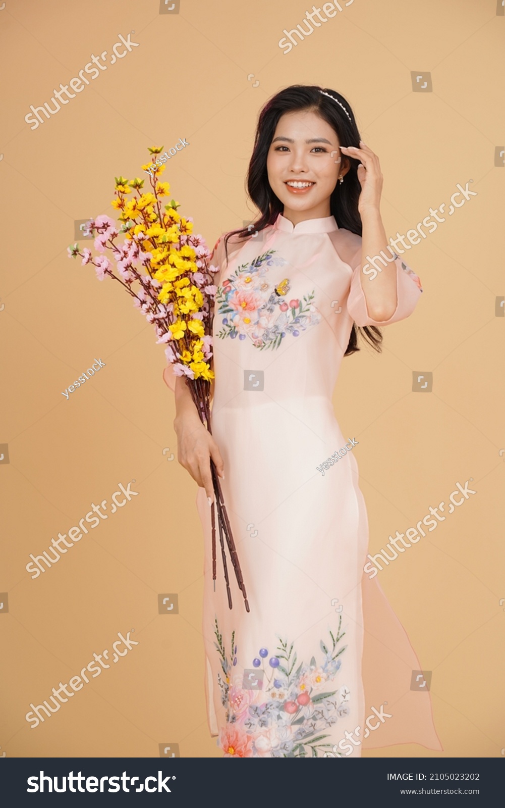 Vietnamese young lady in traditional robe for Lunar New Year Festival Season #2105023202