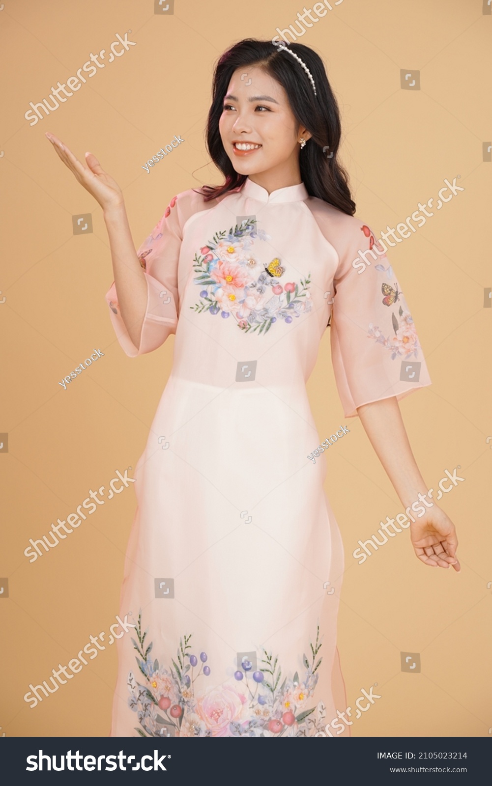 Vietnamese young lady in traditional robe for Lunar New Year Festival Season #2105023214