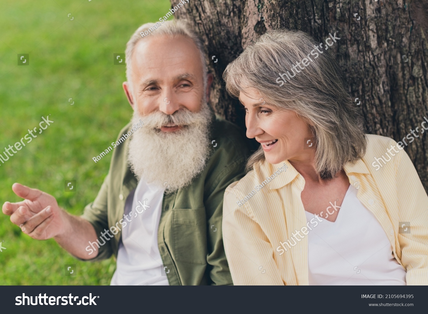 Photo of happy old cheerful grey haired retired pensioner happy people sit tree enjoy vacation nature green spring outside outdoors in park #2105694395