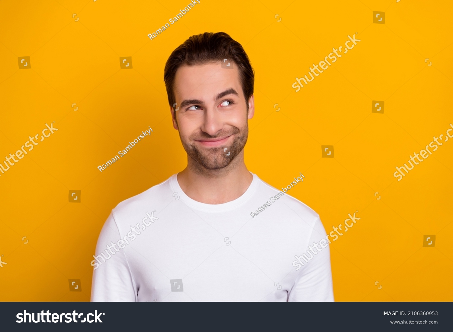 Photo of young man wondered look empty space thoughtful dreamy isolated over yellow color background #2106360953