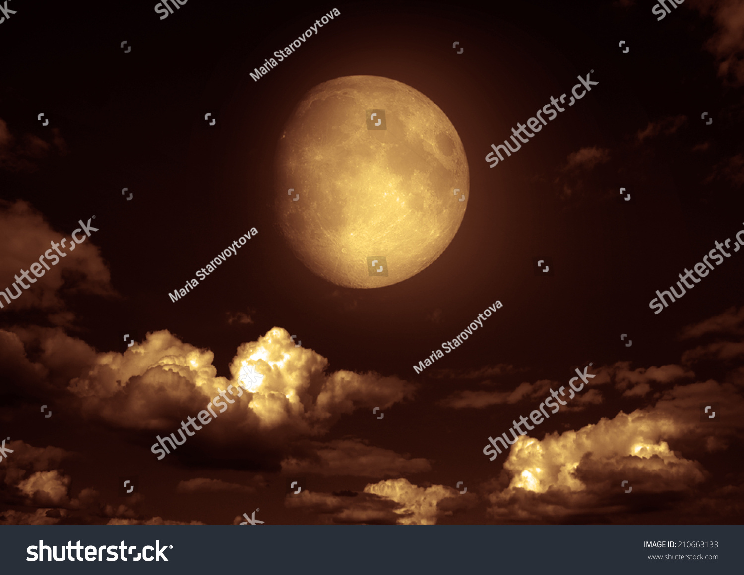 The moon in the night sky in clouds "Elements of this image furnished by NASA" #210663133