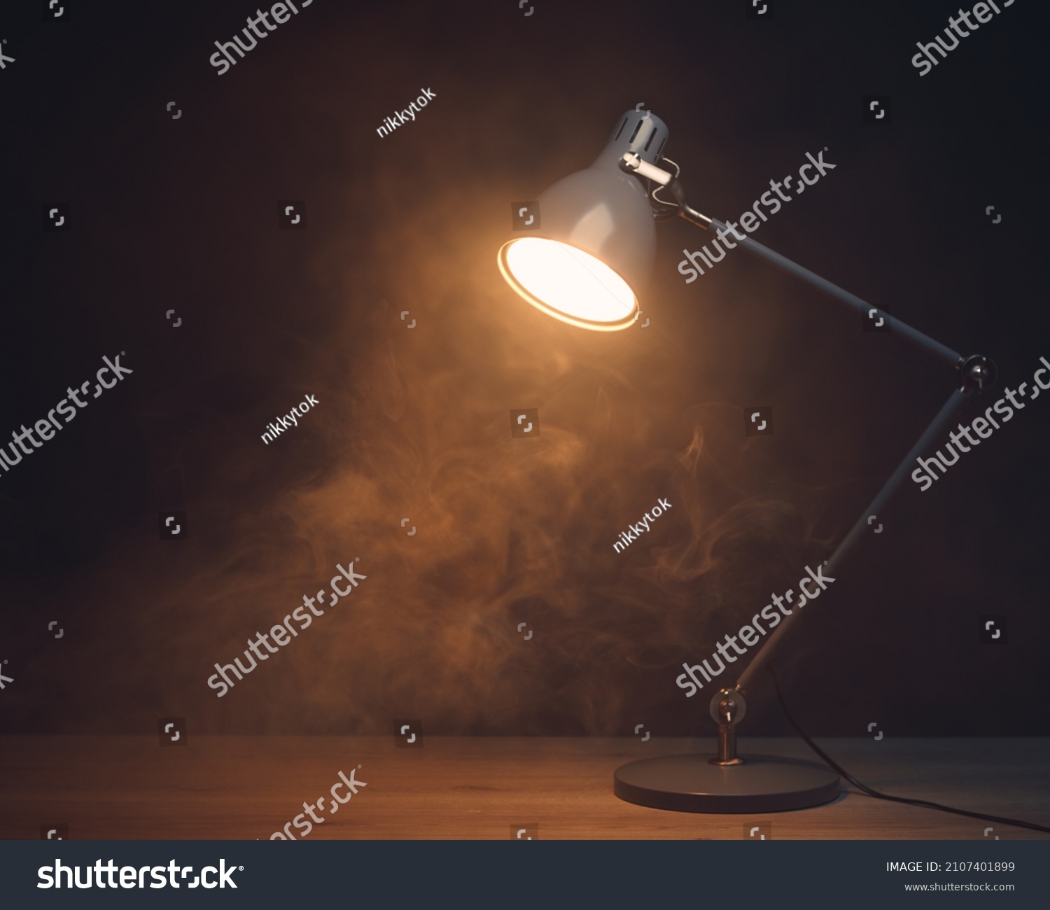 desk lamp in smoke, copy-space background #2107401899
