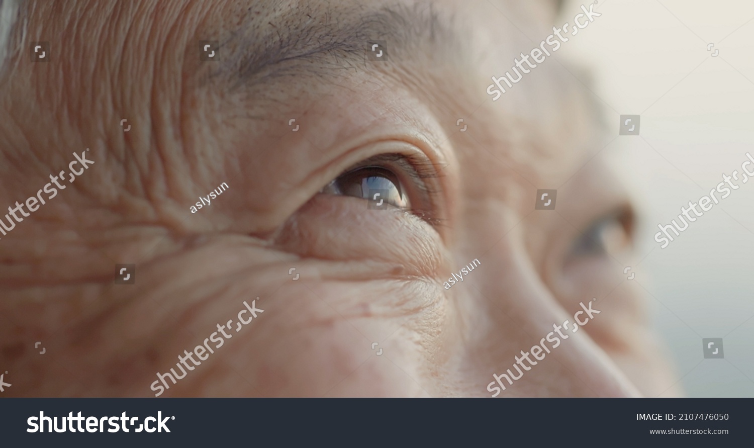 close up shot of asian old man eye #2107476050